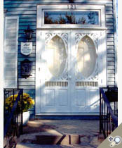 Southern Grace double door painted white. Shown withe tempeed storm insert. Browse more Victorian deisgns that can be made into double doors.